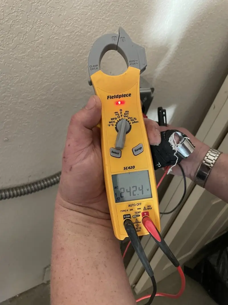Voltage testing with clamp meter during Generator Installation in Wilkins